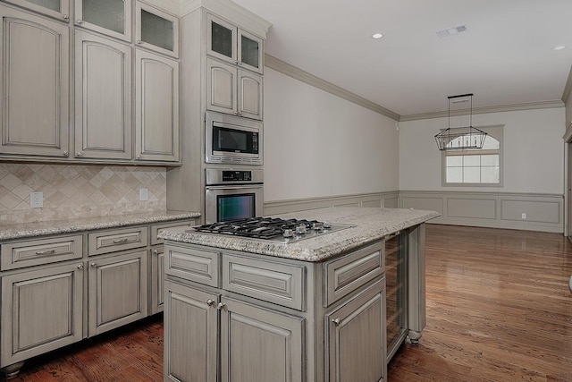 kitchen with stainless steel appliances, wainscoting, crown molding, glass insert cabinets, and dark wood-style flooring