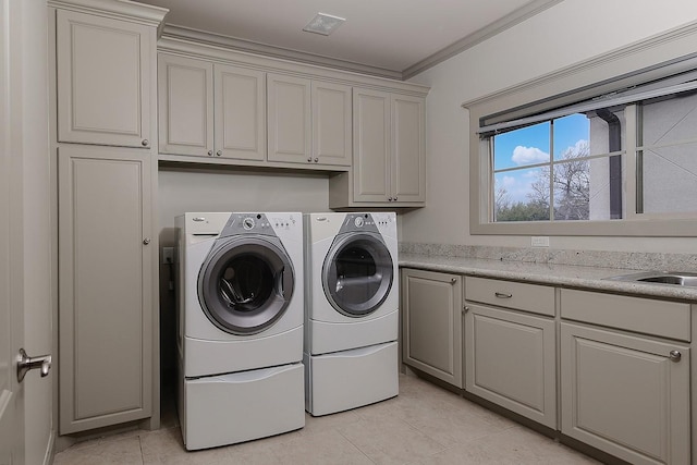 clothes washing area featuring visible vents, independent washer and dryer, ornamental molding, cabinet space, and light tile patterned flooring