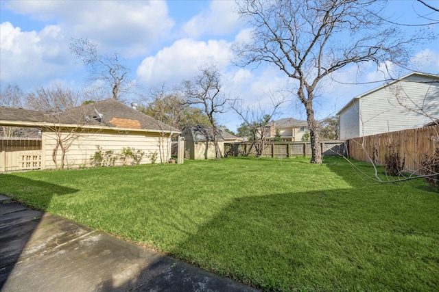 view of yard with a fenced backyard