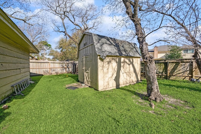 view of shed with a fenced backyard