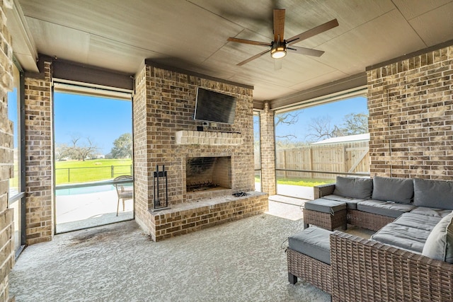 view of patio featuring a fenced backyard, a ceiling fan, and an outdoor living space with a fireplace