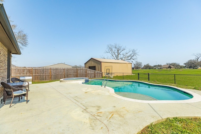 view of swimming pool featuring a patio, a fenced backyard, a pool with connected hot tub, an outdoor structure, and a lawn