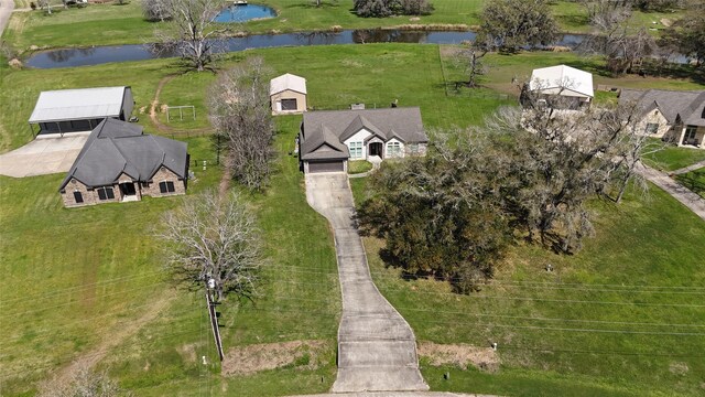 drone / aerial view with a water view