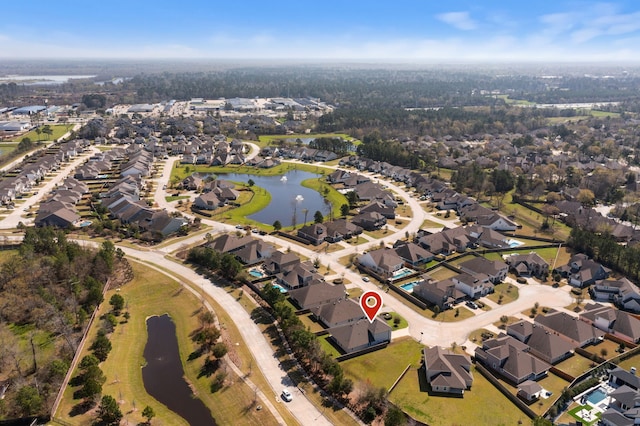 bird's eye view featuring a residential view and a water view