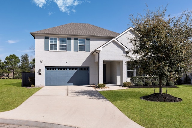 traditional home featuring brick siding, a front yard, concrete driveway, and an attached garage