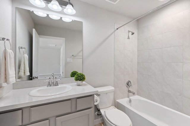 bathroom featuring vanity, shower / tub combination, toilet, and visible vents