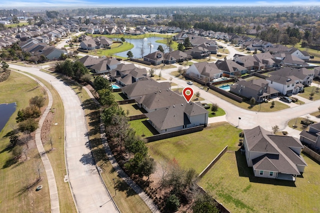 aerial view with a residential view and a water view