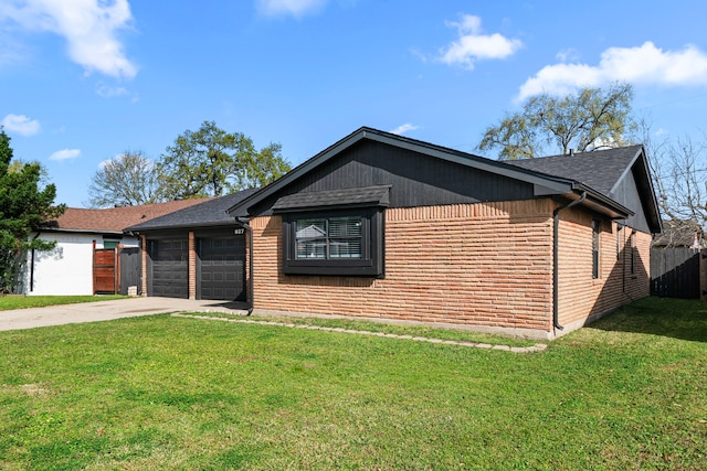 ranch-style house featuring an attached garage, concrete driveway, a front lawn, and fence