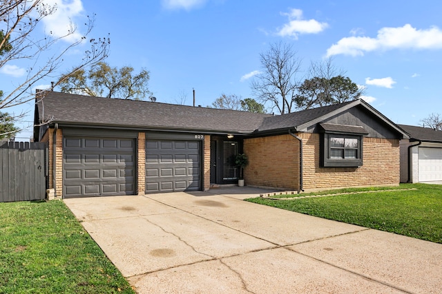 ranch-style home featuring brick siding, an attached garage, a shingled roof, and driveway