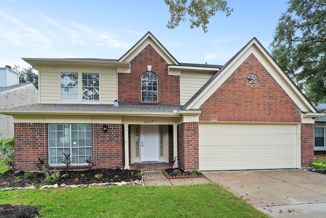 traditional-style house featuring brick siding and driveway