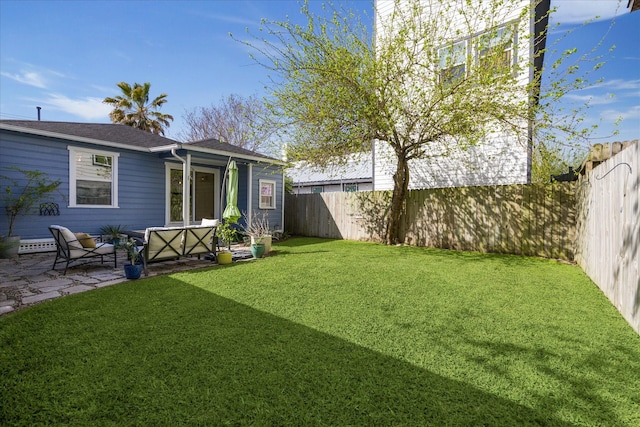 back of property featuring a patio area, a yard, and a fenced backyard