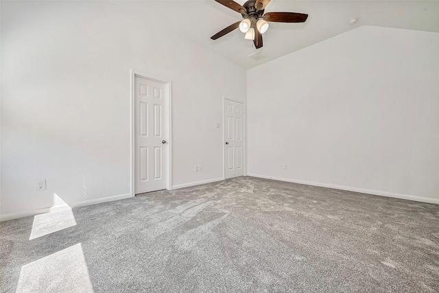 carpeted empty room with a ceiling fan, baseboards, and high vaulted ceiling