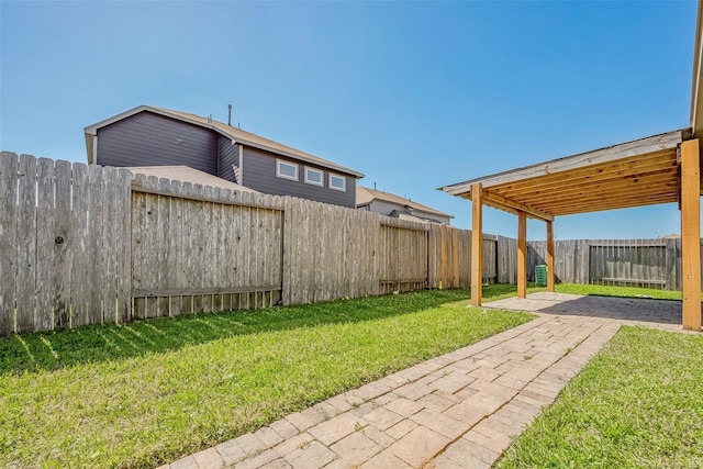 view of yard with a patio and a fenced backyard