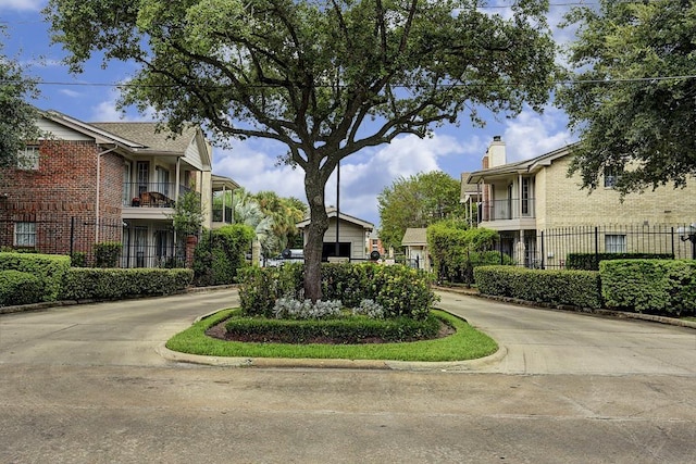 view of property's community featuring fence