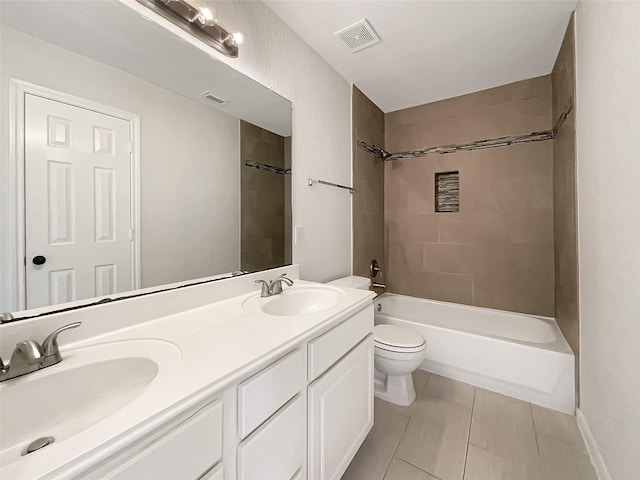 full bathroom with a sink, visible vents, toilet, and double vanity