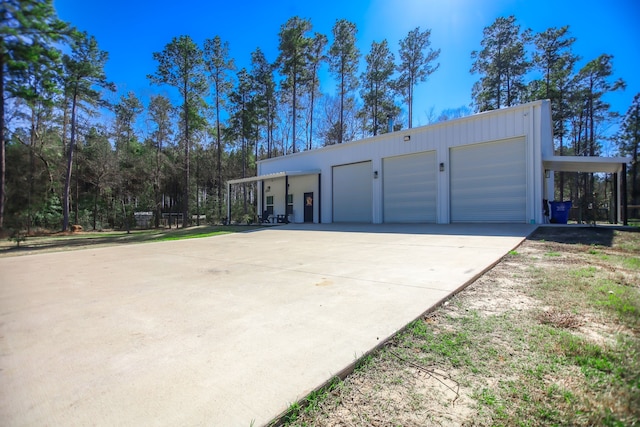 garage with concrete driveway