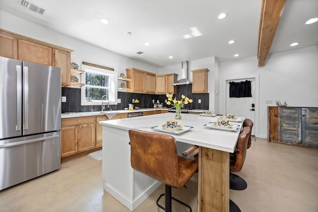 kitchen with visible vents, open shelves, finished concrete flooring, freestanding refrigerator, and wall chimney exhaust hood
