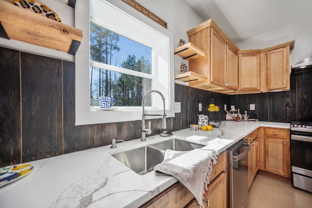 kitchen featuring a sink, range with gas stovetop, dishwasher, and a healthy amount of sunlight