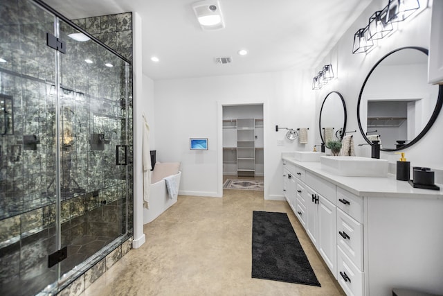 full bathroom featuring a shower stall, double vanity, visible vents, and a sink