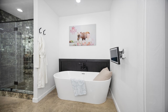 full bath with a soaking tub, recessed lighting, and a stall shower