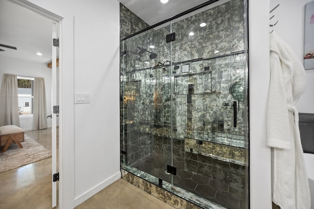 full bathroom featuring recessed lighting, baseboards, concrete floors, and a stall shower