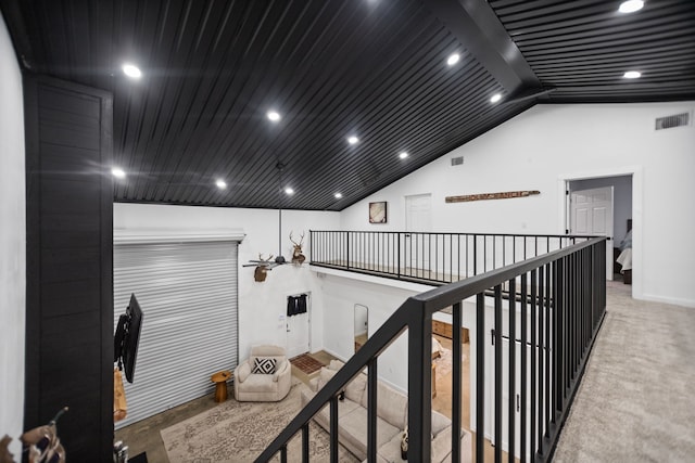 interior space with lofted ceiling, carpet flooring, recessed lighting, and visible vents