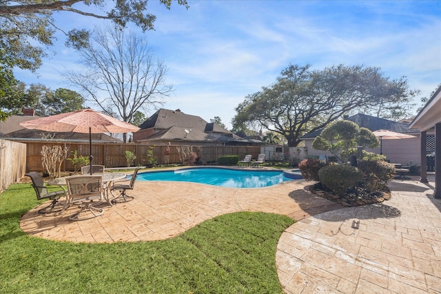 view of swimming pool featuring a patio area, a fenced in pool, and a fenced backyard