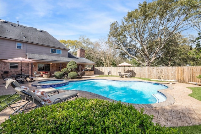 view of pool with outdoor dining area, a fenced backyard, a fenced in pool, an in ground hot tub, and a patio area