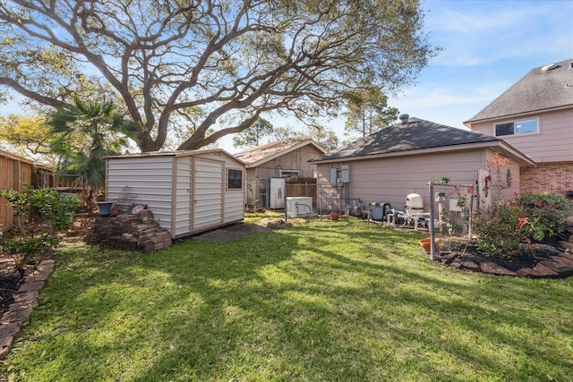 rear view of property featuring a storage unit, a fenced backyard, a yard, and an outdoor structure