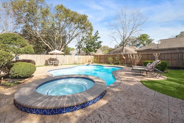 view of swimming pool featuring a fenced in pool, a patio, an in ground hot tub, and a fenced backyard