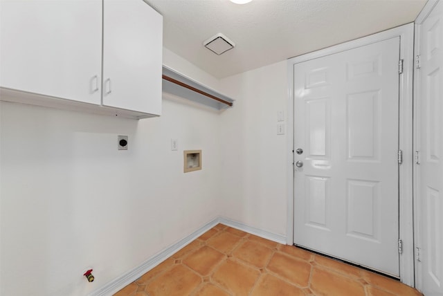 laundry area featuring baseboards, washer hookup, light tile patterned floors, cabinet space, and a textured ceiling