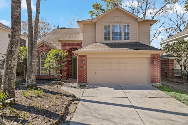 traditional-style house with driveway, brick siding, a garage, and roof with shingles