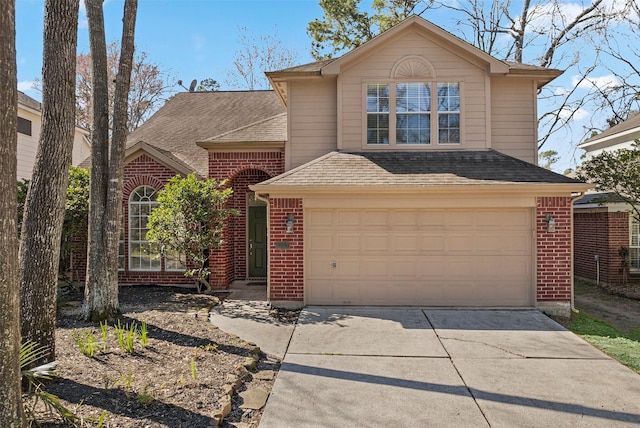 traditional home with a garage, brick siding, and roof with shingles