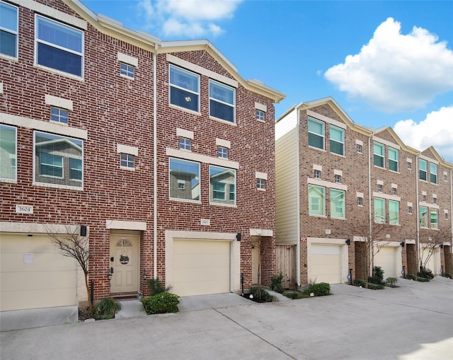 8705 Bryam St Unit 1605, Houston, TX 77061 - view of property with driveway and a garage
