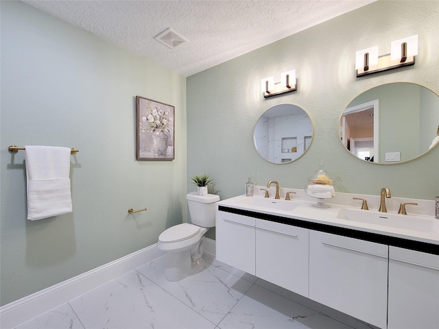 bathroom featuring toilet, visible vents, marble finish floor, and a sink