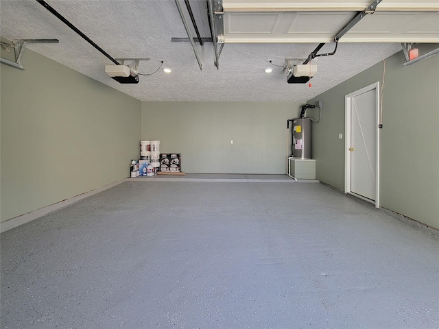 garage featuring a garage door opener and electric water heater