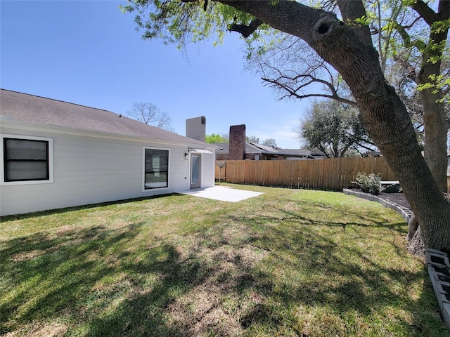 view of yard featuring a patio and fence