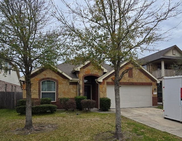 ranch-style home with a garage, brick siding, stone siding, and driveway