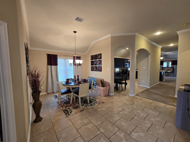 dining room with visible vents, arched walkways, vaulted ceiling, crown molding, and a notable chandelier