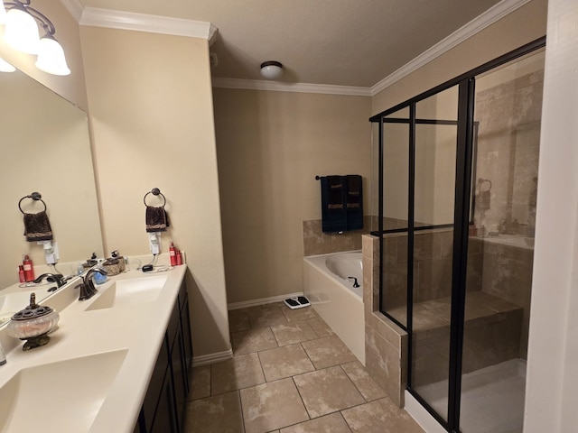 bathroom featuring a sink, ornamental molding, a shower stall, a garden tub, and tile patterned floors