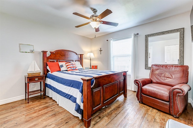 bedroom featuring baseboards, light wood-style floors, and ceiling fan