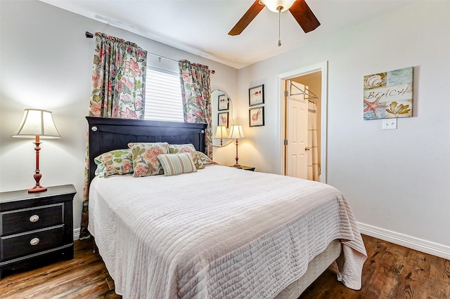 bedroom featuring a ceiling fan, wood finished floors, and baseboards