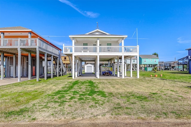 back of property featuring a carport and a yard