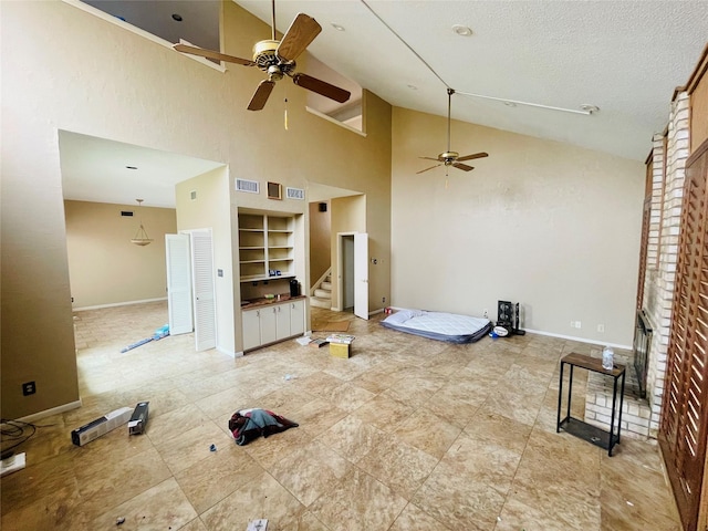 interior space featuring visible vents and ceiling fan