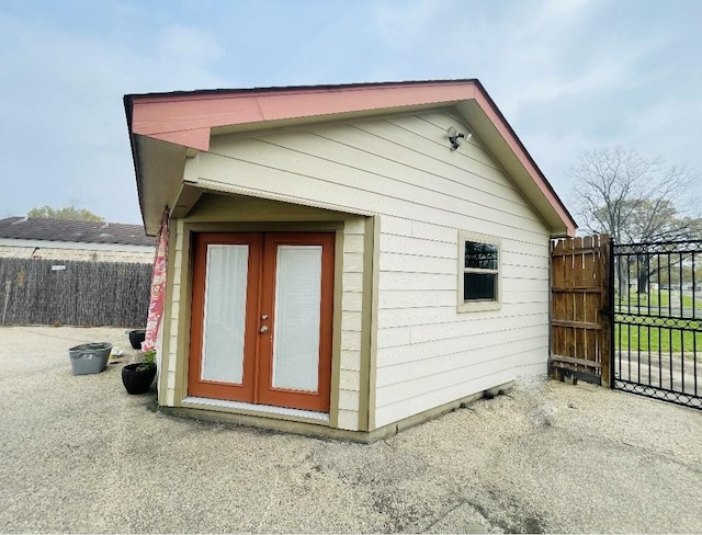 view of outbuilding featuring an outbuilding and fence