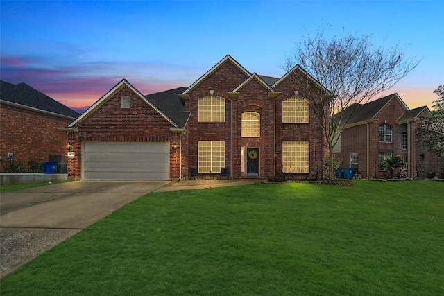 traditional-style home featuring brick siding, a lawn, an attached garage, and concrete driveway