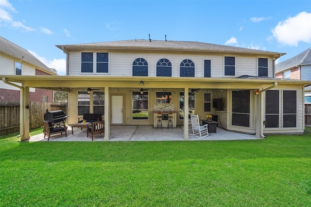 back of house featuring a patio, a yard, fence, and ceiling fan