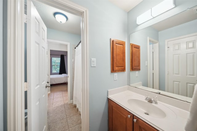 bathroom featuring tile patterned flooring and vanity