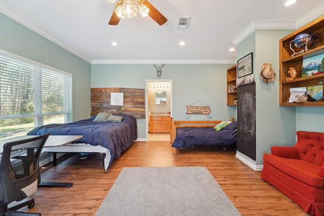 bedroom featuring visible vents, ornamental molding, baseboards, and wood finished floors