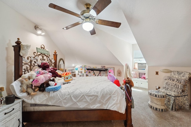 bedroom with vaulted ceiling, carpet floors, and ceiling fan